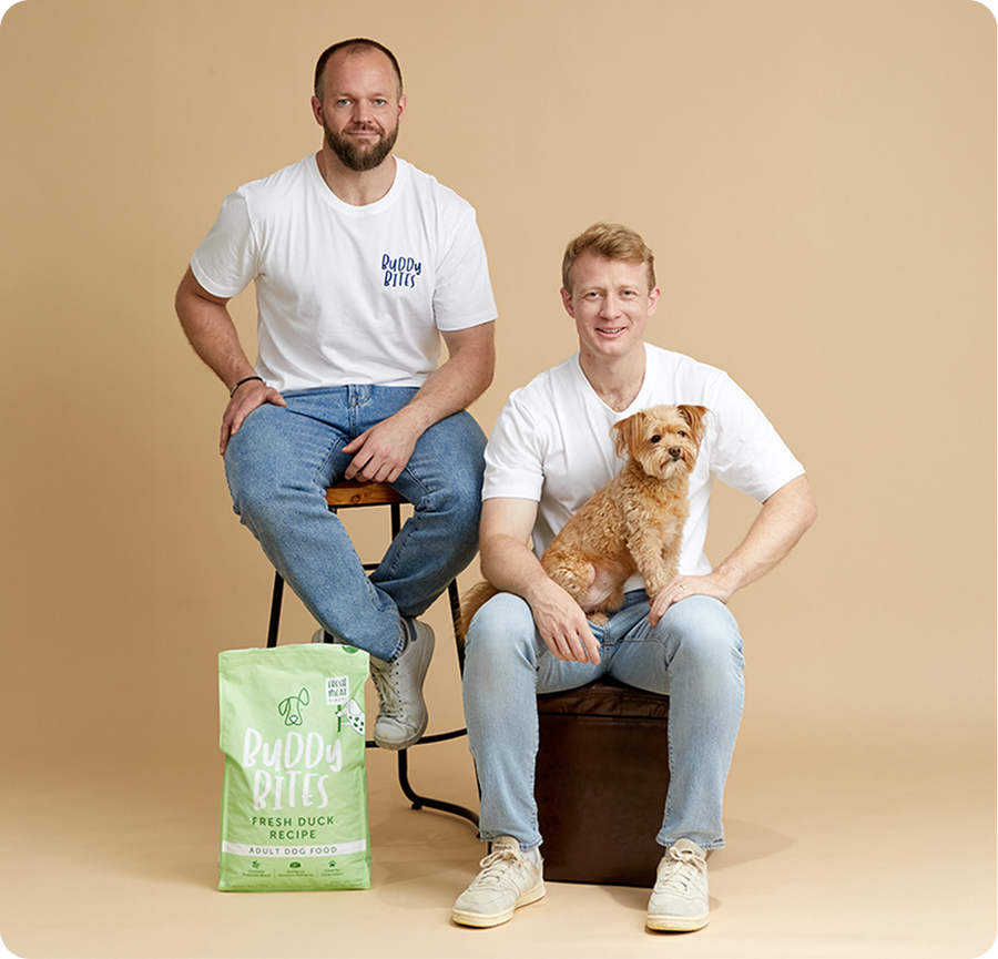 The Buddy Bites founders with their dogs